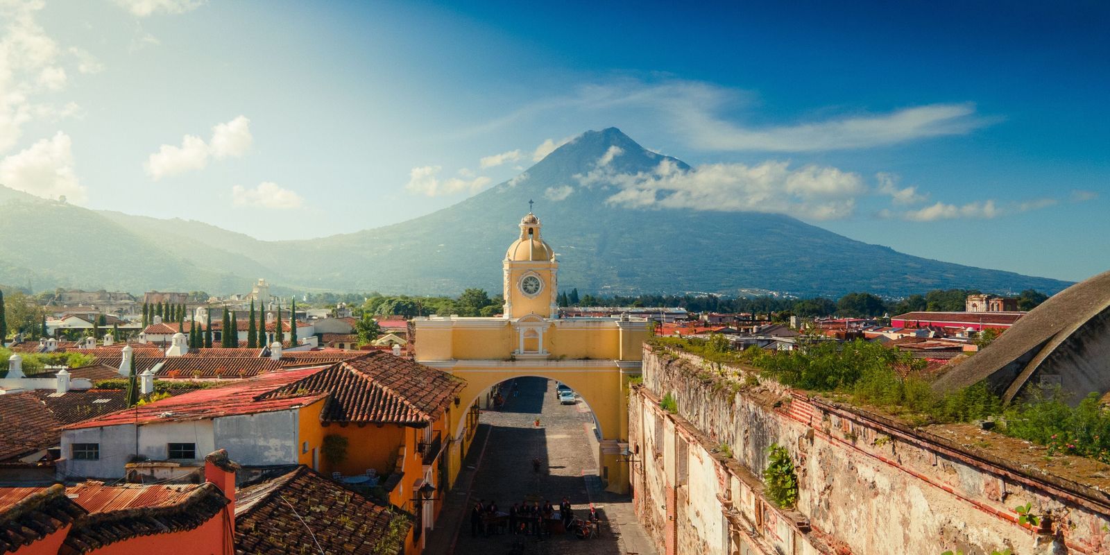 The Santa Catalina Arch in Antigua Guatemala, with Volcán de Agua rising behind it